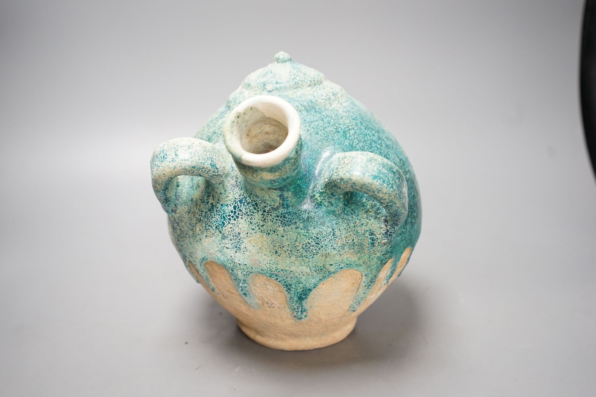 A Kashan turquoise glazed azed jar, 13th/14th century, 22cm